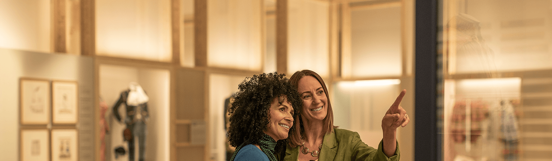 Two females smiling inside the V&A museum in Dundee