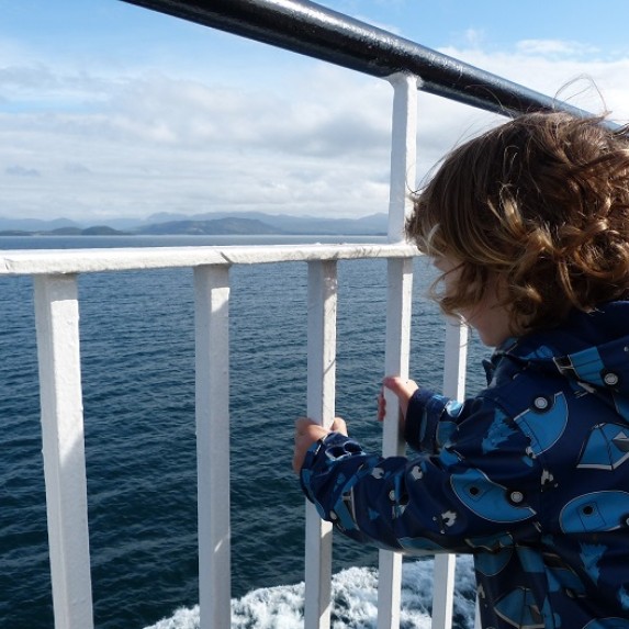 In content - little boy on the boat to Mull