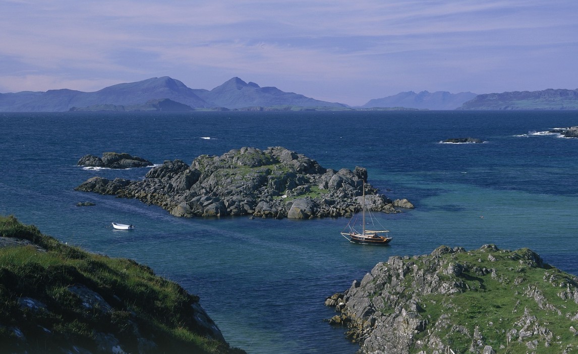 A view over the bay at Arisaig with islands in the background 