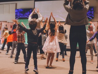 Kids participating in a theatre workshop