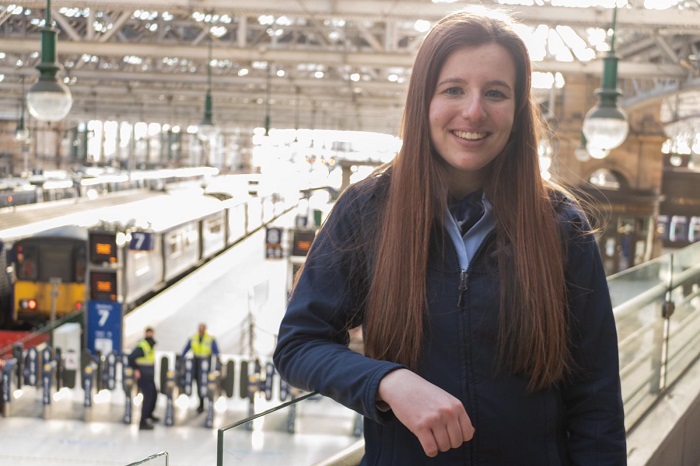Carmen, customer service apprentice standing in Glasgow Central station