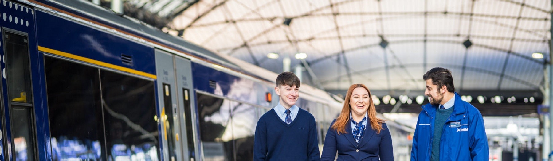 Modern apprentices walking through ScotRail train station