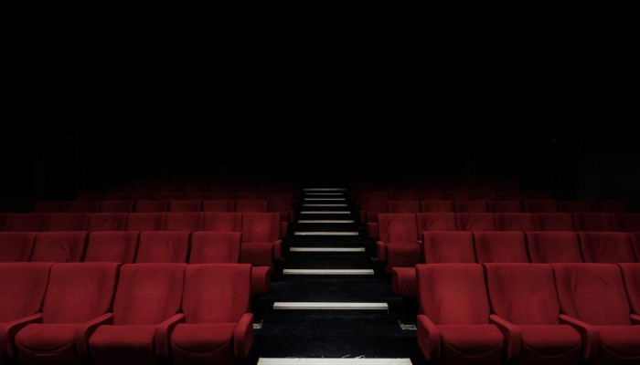 Empty red seats in a theatre