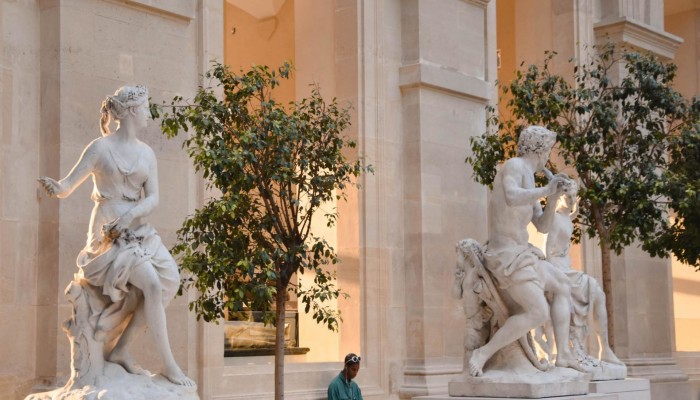 White marble statues outside museum