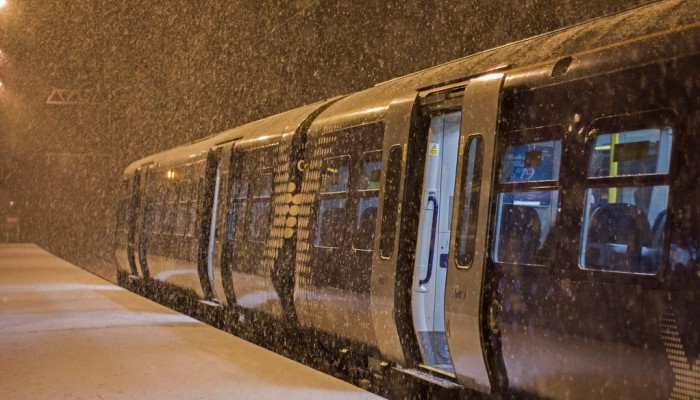 Snow falling on a ScotRail train at Livingston North station