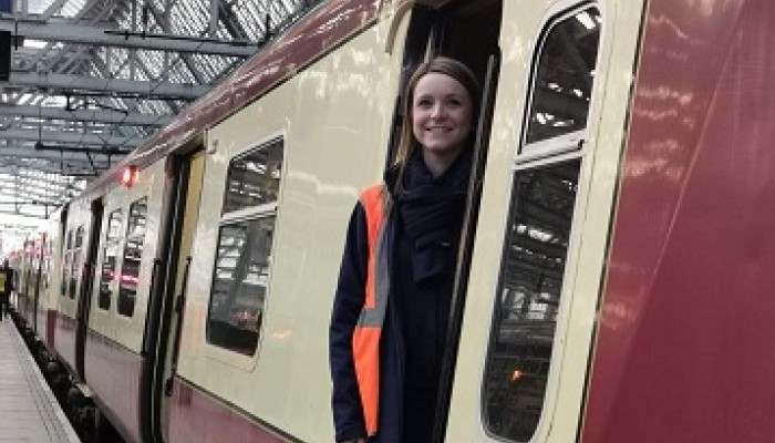 Ashleigh Smart standing at train's door at Glasgow Central