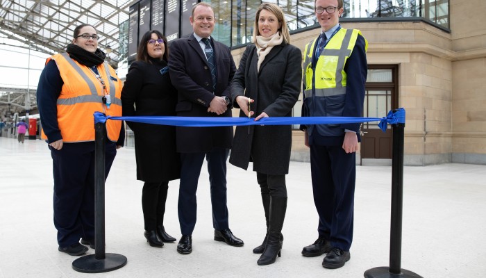 Nicola, Aberdeen station staff; Kirsty Devlin, ScotRail Head of Projects & PMO; Alex Hynes, Managing Director of Scotland’s Railway; Jenny Gilruth, Transport Minister, Ross, Aberdeen station staff stood in front of new ticket office and first-class lounge cutting blue ribbon to officially open the redevelopment of Aberdeen station