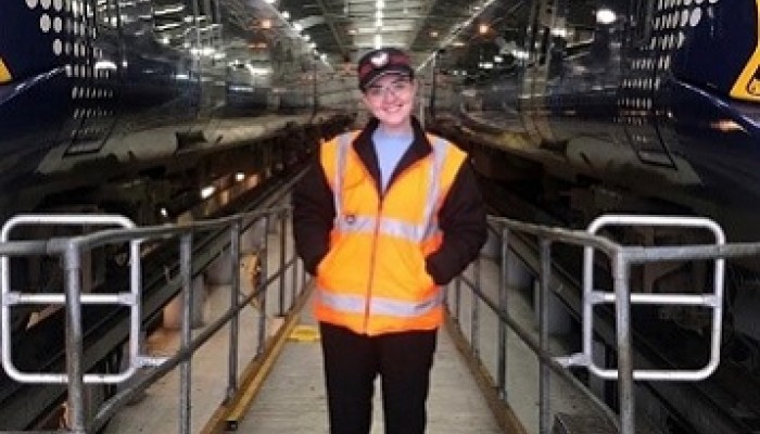 Emma Armstrong, fleet engineer, standing in a ScotRail depot