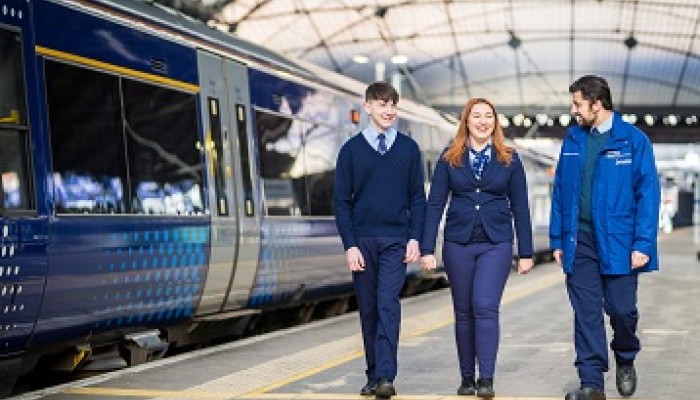 Modern apprentices walking through ScotRail train station