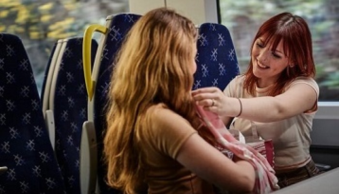 Ladies travelling on ScotRail train following a shopping trip