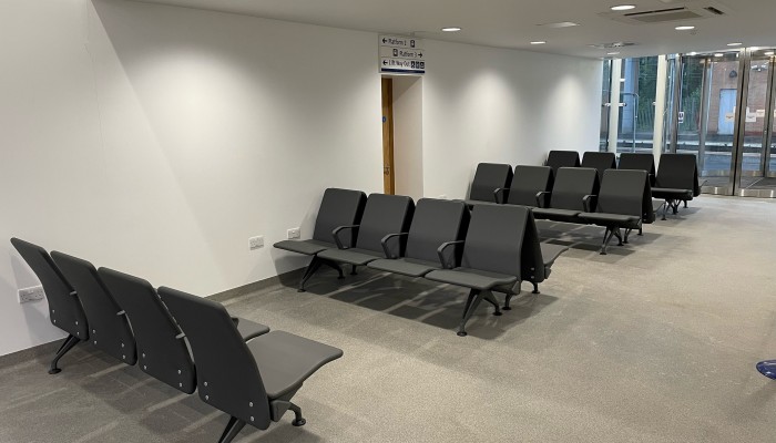 New customer lounge area at Motherwell station with softer lighting and padded seats.