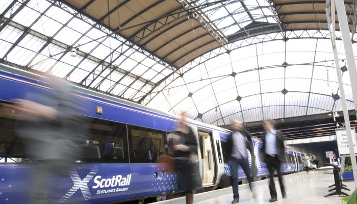 Train and passengers at Glasgow Queen Street station